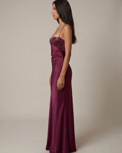Side view of burgundy formal halter maxi dress with beaded bodice
