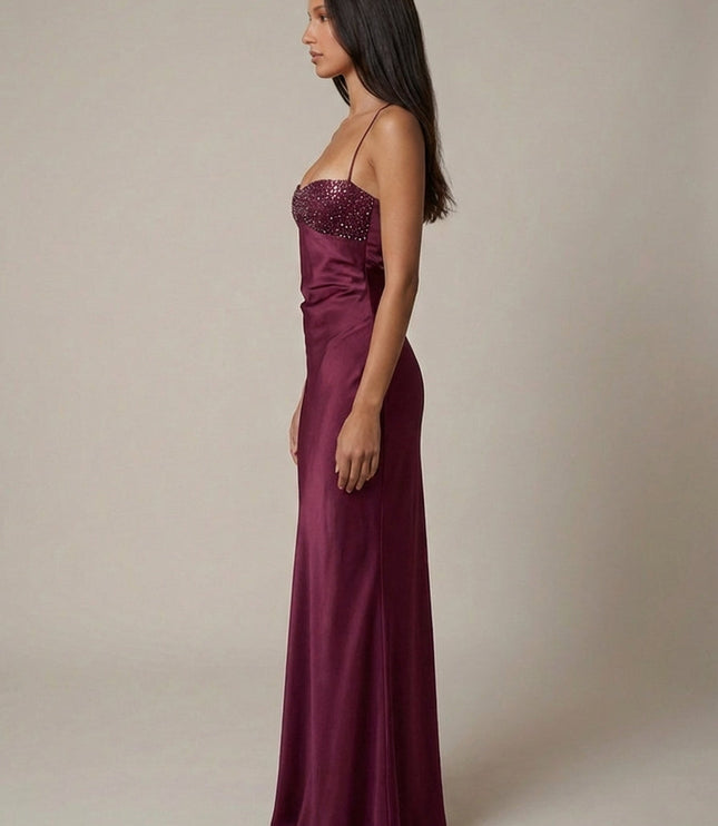 Side view of burgundy formal halter maxi dress with beaded bodice