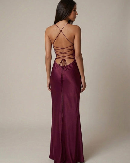 Back view of burgundy halter maxi dress showing lace-up strappy back