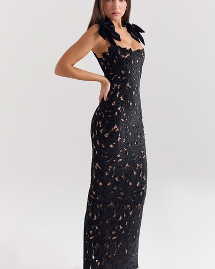 Side view of black lace formal maxi dress with bow details