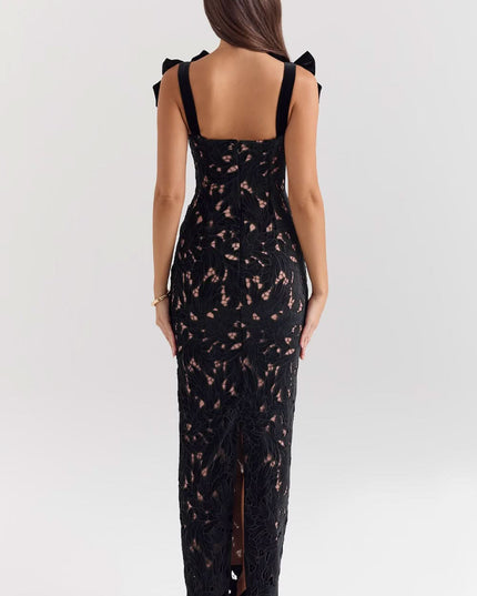 Back view of black lace maxi dress showing open back and slit