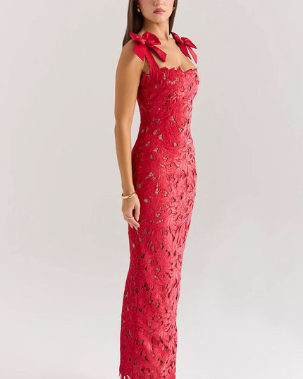 Side profile of red lace formal maxi dress with bow shoulders