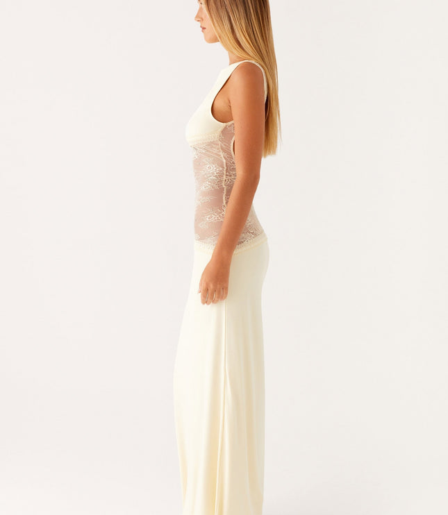 Side profile of cream maxi dress with transparent lace waist