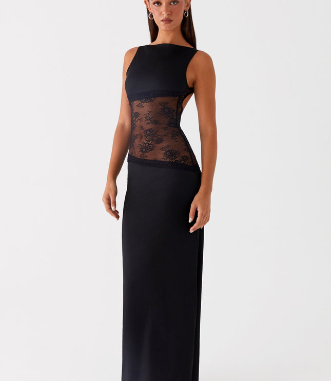 Side view of black formal maxi dress with lace waist cutout