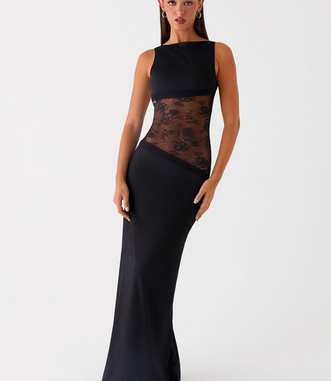 Front view of black maxi dress with sheer lace waist and solid skirt
