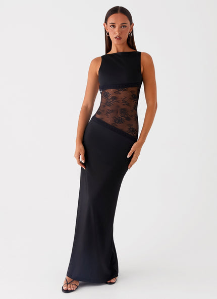 Front view of black maxi dress with sheer lace waist and solid skirt