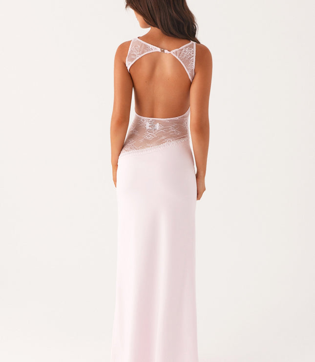 Back view of pale pink formal maxi dress with lace waist cutout