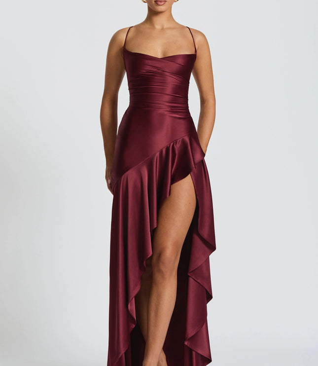 Burgundy satin cowl neck high-low maxi dress with draped waist and side slit