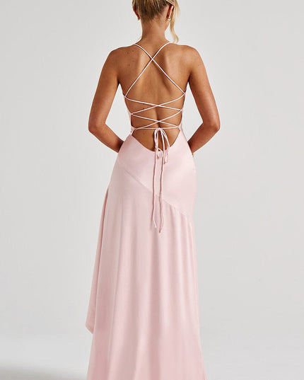 Rear detail of pink formal dress showing laced back design and flowing train