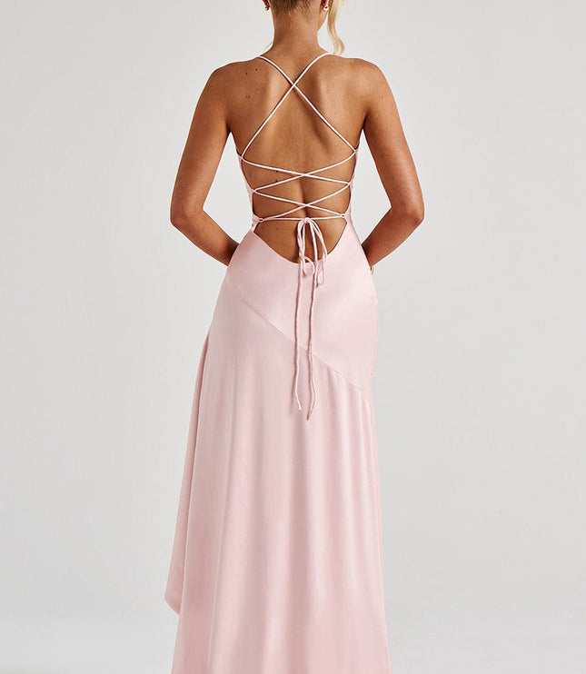 Rear detail of pink formal dress showing laced back design and flowing train