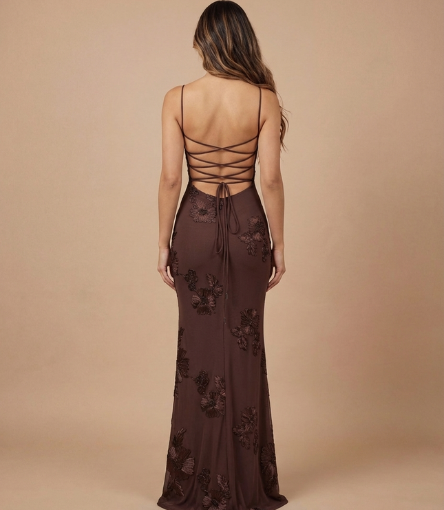 Back view of brown floral maxi dress with lace-up open back and sheer floor-length skirt