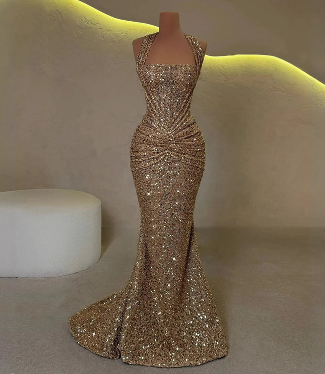 Gold sequin maxi dress on mannequin with halter top, ruched waist, and flared hem