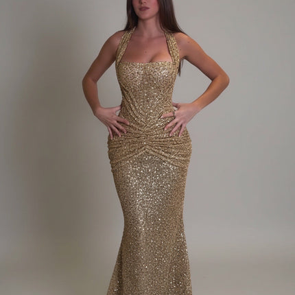 Gold sequin maxi dress with halter neckline and ruched waist, front view