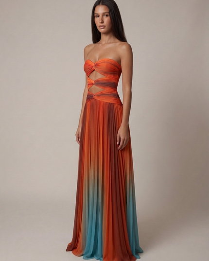 Three-quarter view of women's wedding guest ombre strapless maxi dress with fitted waist