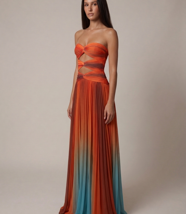 Three-quarter view of women's wedding guest ombre strapless maxi dress with fitted waist