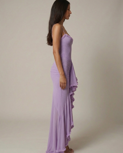 Side view of a lavender cocktail maxi dress with straps, fitted silhouette, and ruffled hem