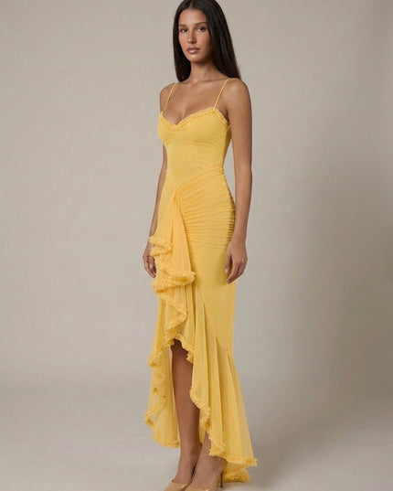 Yellow cocktail maxi dress with ruffle trim, spaghetti straps, and flowing front overlay