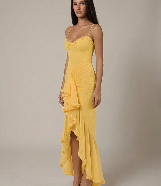 Yellow cocktail maxi dress with ruffle trim, spaghetti straps, and flowing front overlay