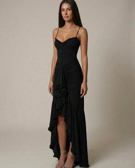 Front view of black maxi dress with fitted bodice, ruched waist, and layered ruffle hem