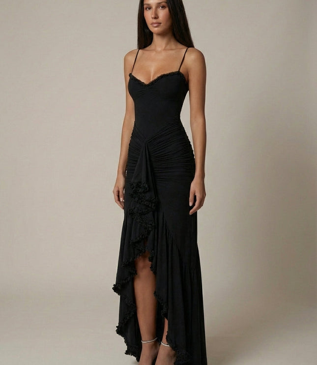 Front view of black maxi dress with fitted bodice, ruched waist, and layered ruffle hem