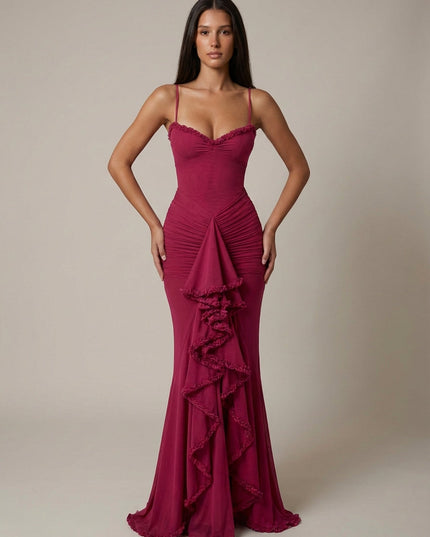 Magenta cocktail maxi dress with ruffle trim, spaghetti straps, and front draped detail
