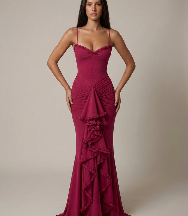 Magenta cocktail maxi dress with ruffle trim, spaghetti straps, and front draped detail