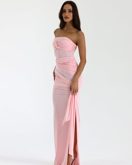 Side view blush strapless ruched maxi dress with thigh-high slit and long drape detail