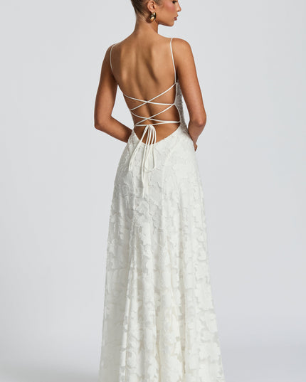 Back view of white lace maxi dress with criss-cross strappy back detail