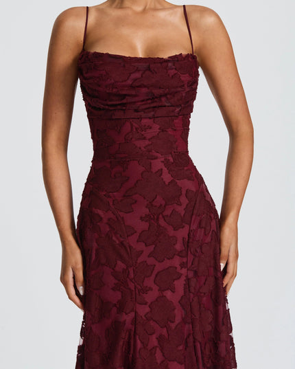 Close-up of burgundy floral lace cowl neck formal maxi dress bodice