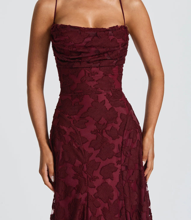 Close-up of burgundy floral lace cowl neck formal maxi dress bodice