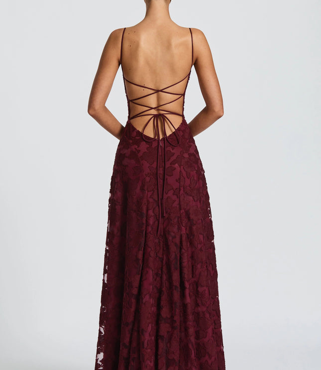 Back view of burgundy lace maxi dress with lace-up strappy back detail