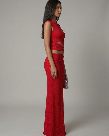 Side profile of red lace cropped top with midriff cutout and maxi skirt
