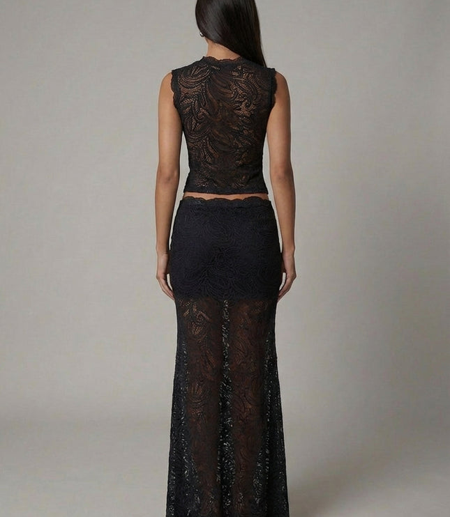 Back view of black lace formal set showing cropped top and flowing maxi skirt