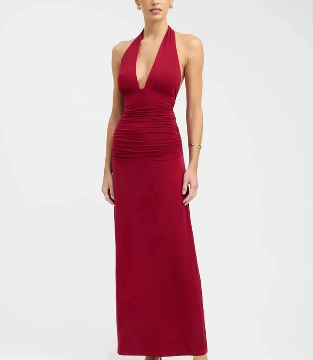 Front view of burgundy formal maxi halter dress with deep V neckline and ruched waist