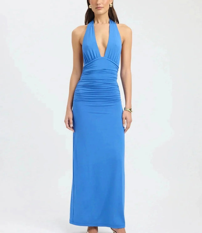 Back view of pale yellow formal maxi halter dress with open back and tie waist