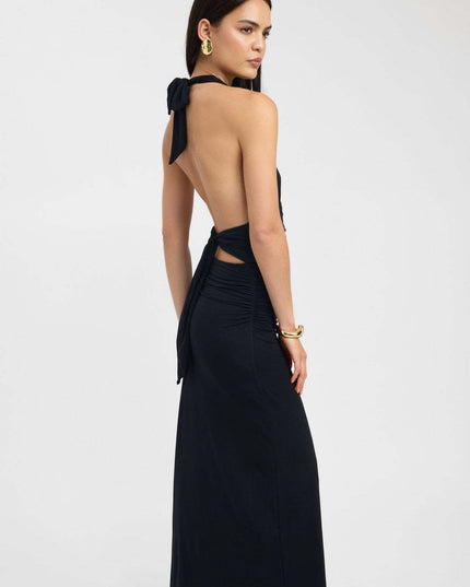 Front view of pale yellow halter maxi dress with deep V neckline and ruched waist