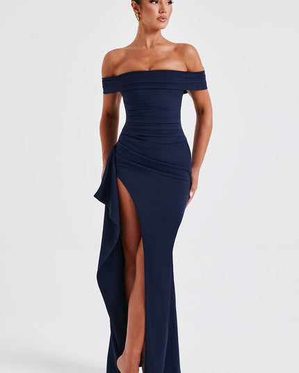 Front view of navy off shoulder maxi dress with ruched bodice, high slit, and fitted shape