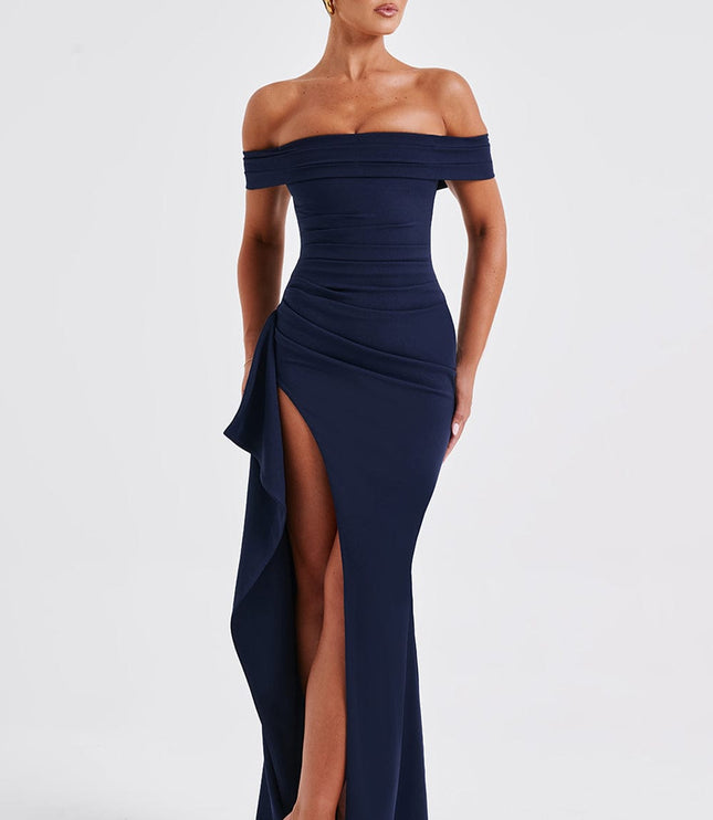 Front view of navy off shoulder maxi dress with ruched bodice, high slit, and fitted shape