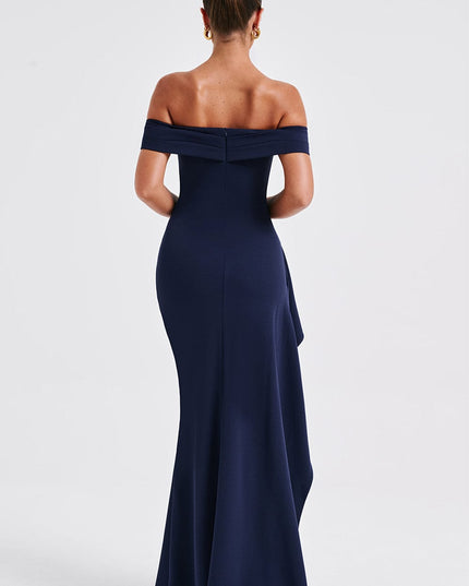 Back view of navy off shoulder maxi dress with open shoulders and long skirt