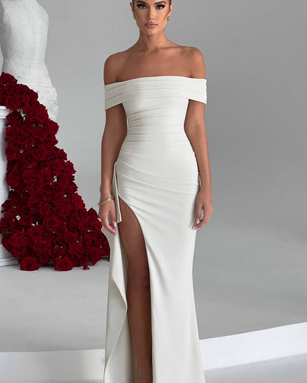 White off shoulder maxi dress with ruched bodice and dramatic thigh slit, front view