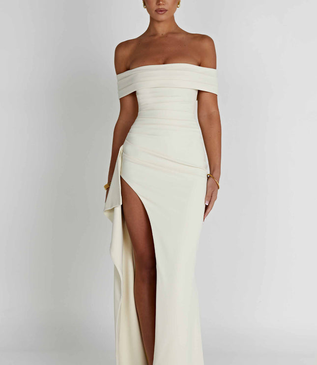 Front view of cream off shoulder formal maxi dress with fitted waist and slit