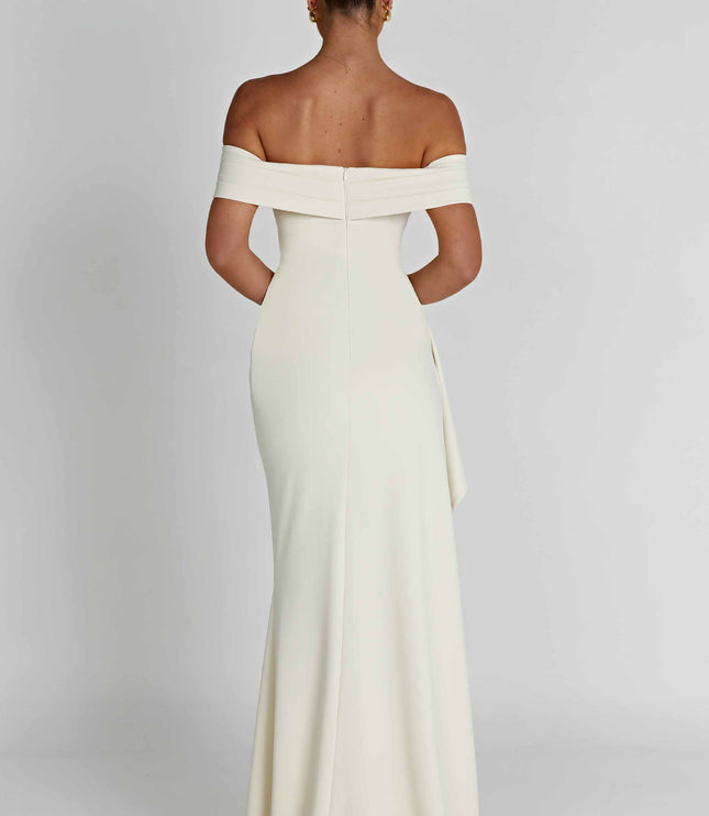 Back view of ivory off shoulder maxi dress with fitted bodice and floor length skirt