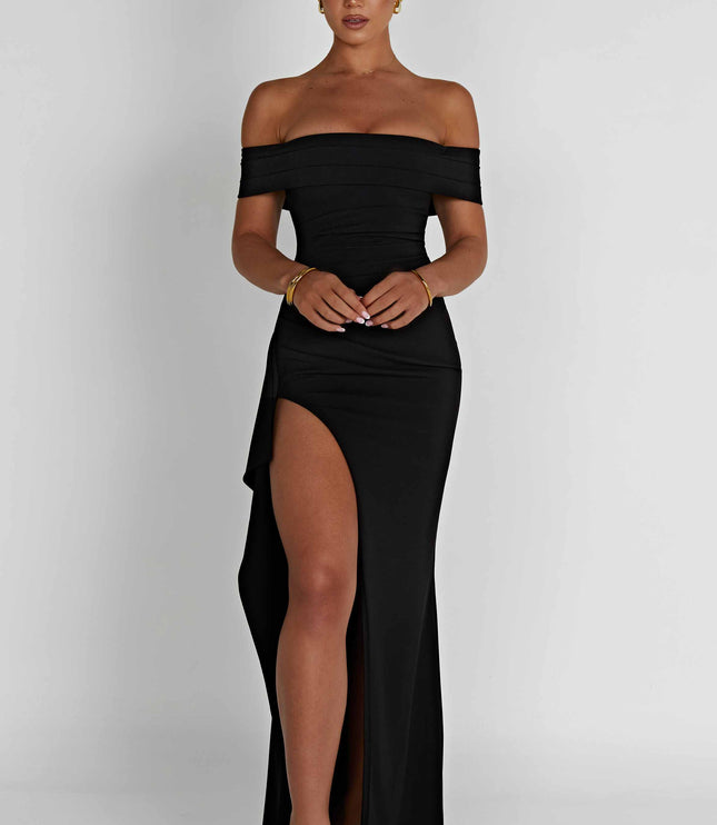 Front view of black off shoulder maxi dress with ruched waist and high leg slit