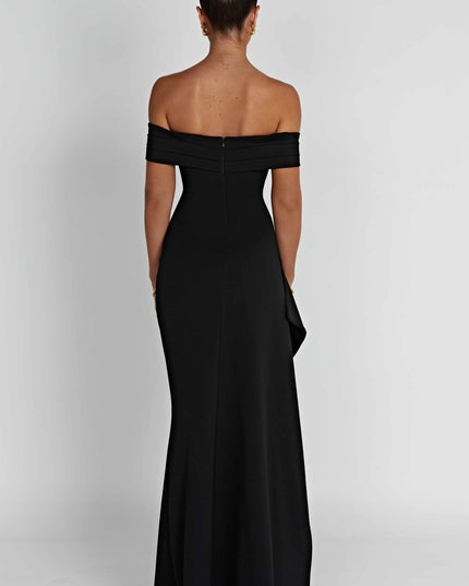 Black off shoulder maxi dress with fitted bodice, asymmetric drape, and formal thigh slit