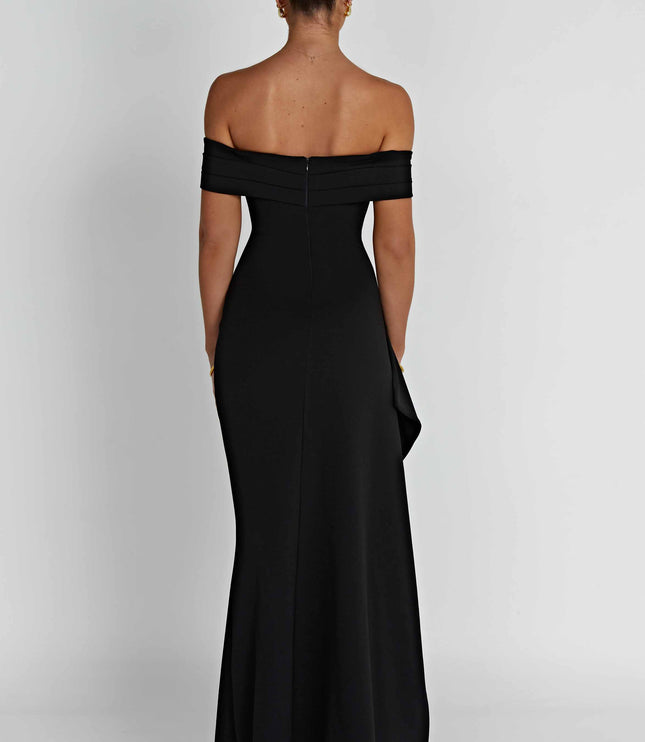 Black off shoulder maxi dress with fitted bodice, asymmetric drape, and formal thigh slit