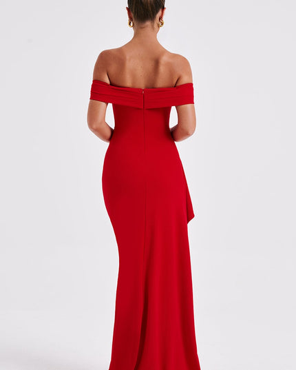 Back view of red off shoulder maxi dress with fitted silhouette and floor length hem