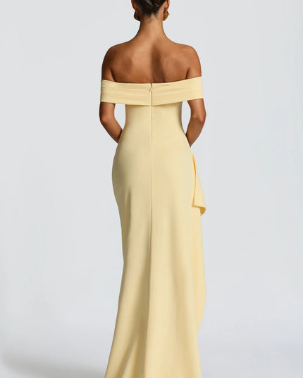 Back view of pale yellow off shoulder maxi dress with zip closure and smooth floor length skirt