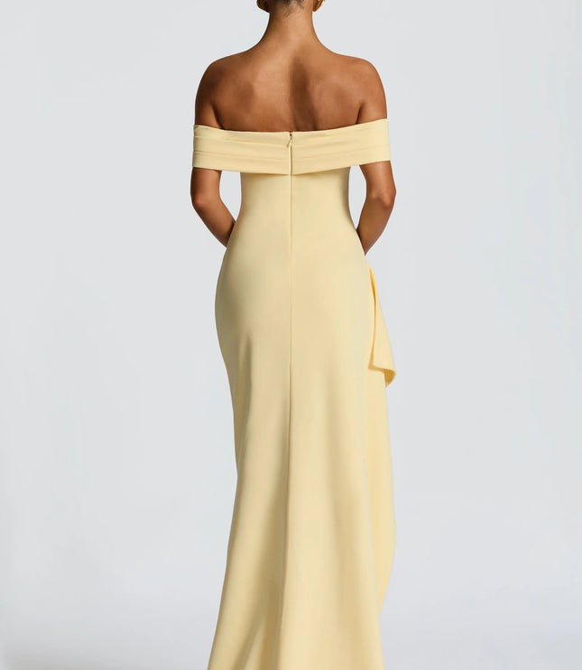Back view of pale yellow off shoulder maxi dress with zip closure and smooth floor length skirt