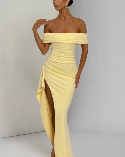Front view of pale yellow off shoulder maxi dress with flowing chiffon panels and formal gown style