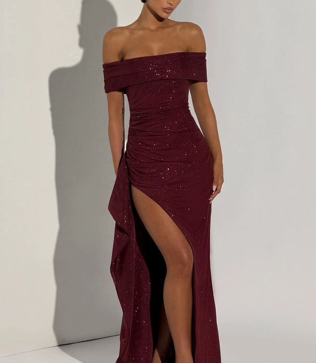 Front view of burgundy formal off shoulder maxi dress with high slit and glittery finish